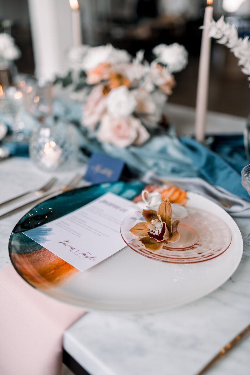 Woman adjusts the details on a wedding reception table