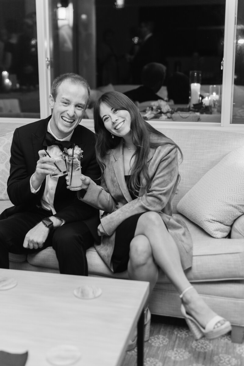 couple-cheers-wedding-reception