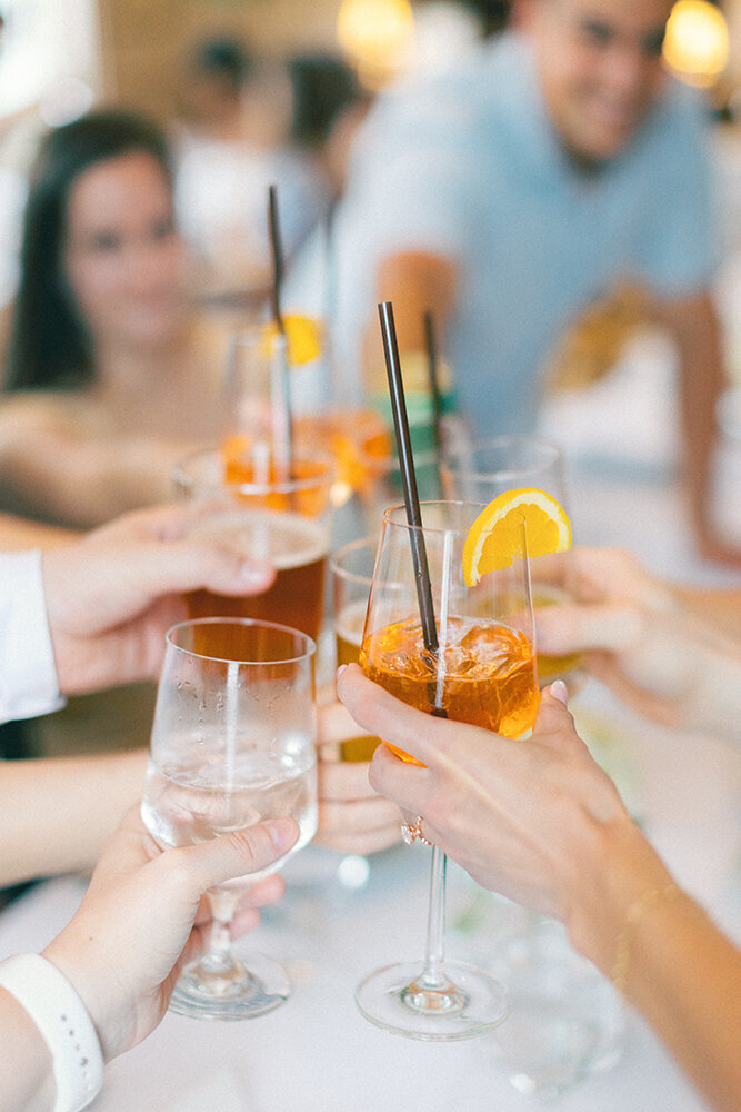 people toasting drinks