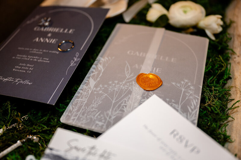 flat lay of an invitation suite for gabrielle and annie wedding
