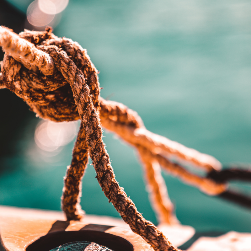 A photo of a rope tied to an anchor just out of view.