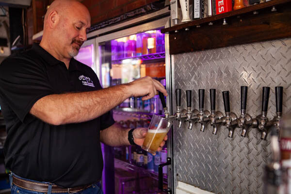 Bartender pouring a cold beer