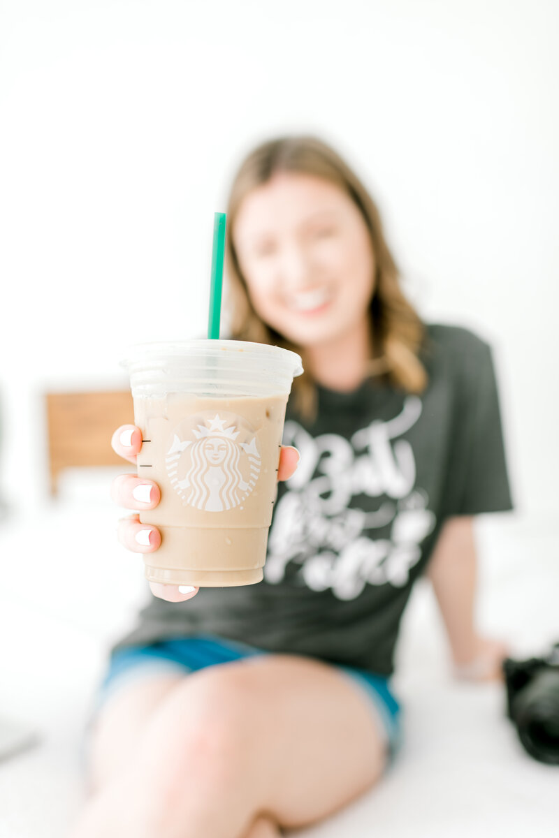 Mary Beth holding iced coffee