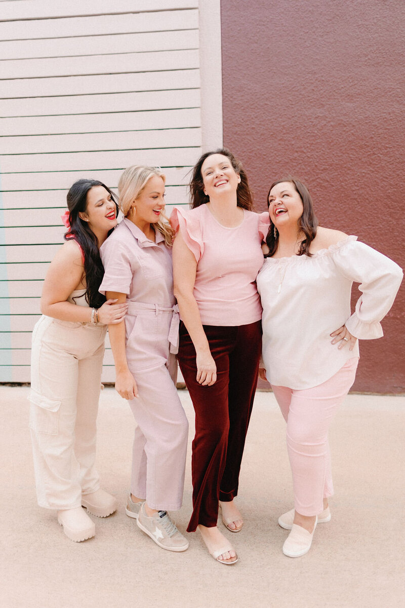 The Tallest Tulip team standing together smiling in coordinating outfits