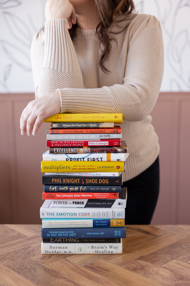 Leaning on pile of books