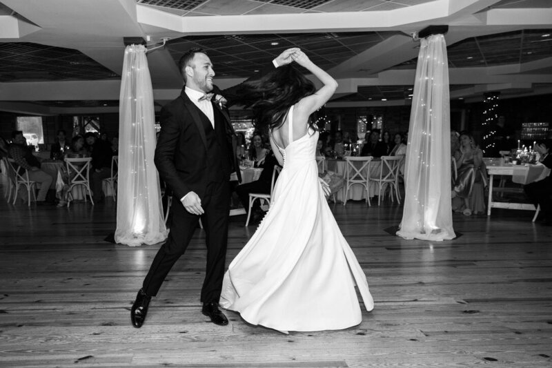 Bride and groom happily dancing