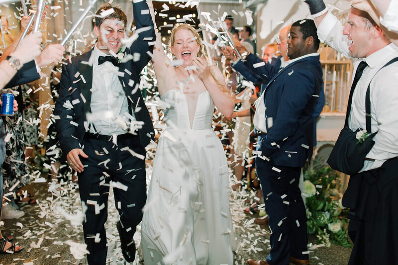 Bride and Groom Exit through confetti photo