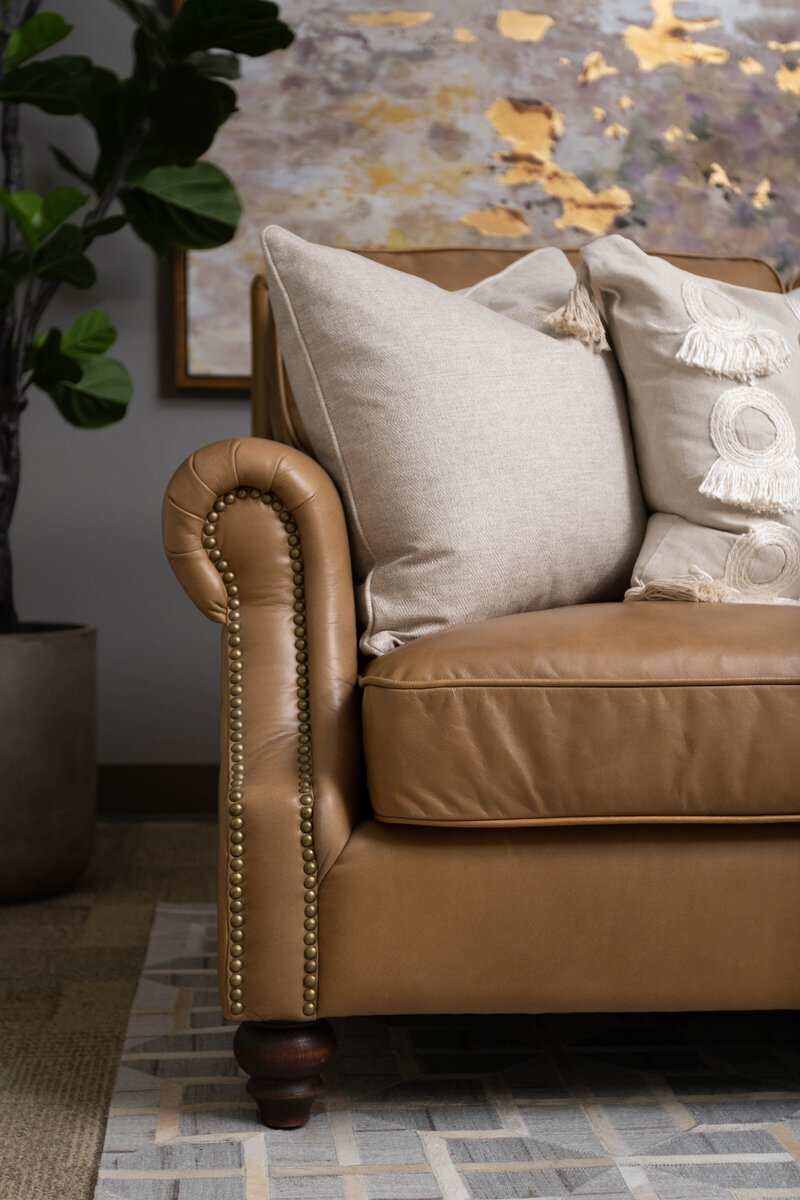 Elevate your living room design with our classic brown leather accent chair, offering timeless appeal.