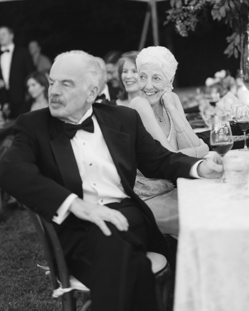 Black and white image of grandparents sitting at a table