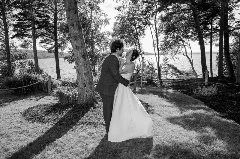 Couple dancing together on grass | Rangeley Lake Wedding Photography