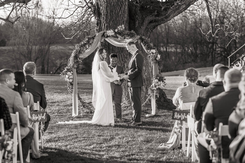 Indiana wedding photography of an outdoor ceremony with a smiling bride and goorm.