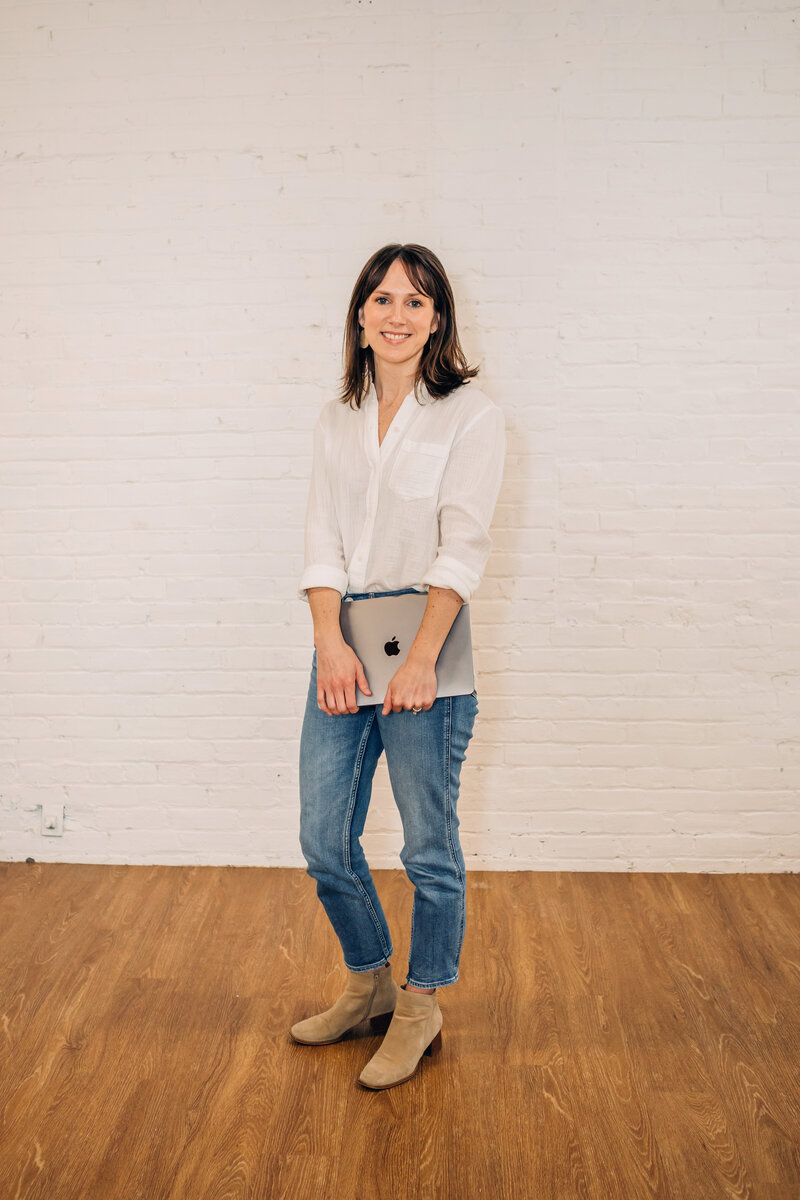 Meghan Goff holding a laptop