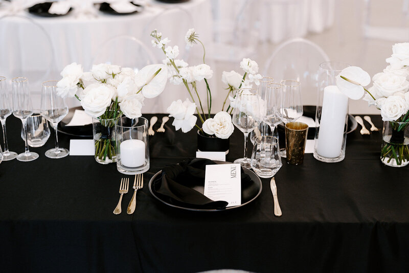 Contemporary black and white wedding tablescape with florals designed by Westmore Events.