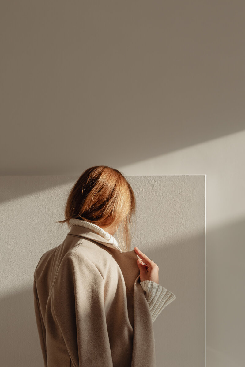 kaboompics_woman-in-white-sweater-beige-wool-jacket-29431