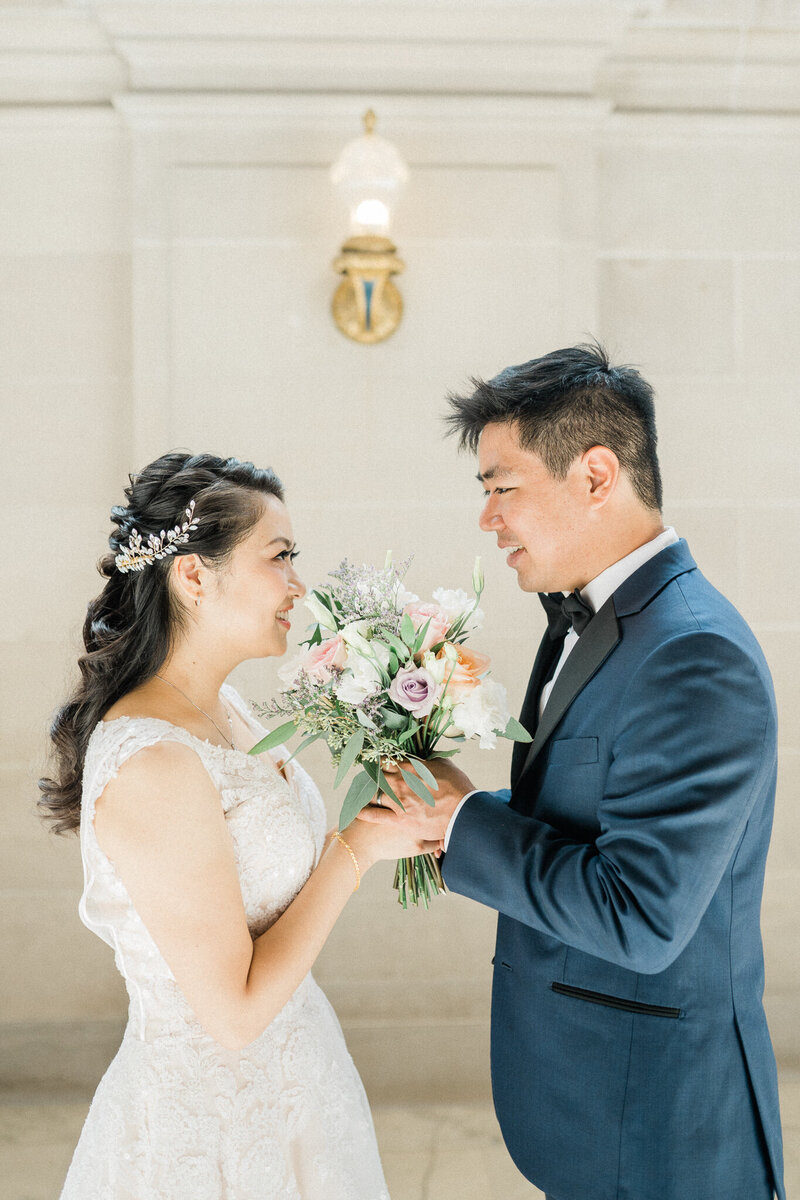 bride and groom get married at san francisco city hall