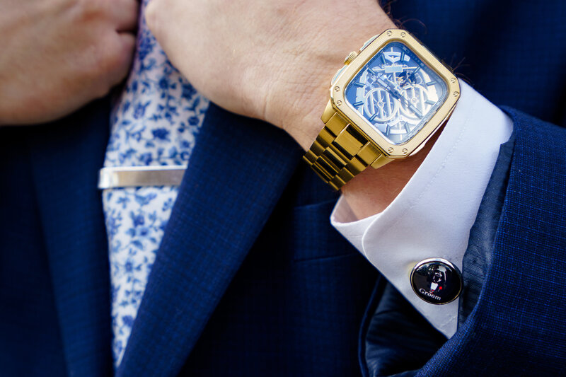 Close-up detail photo of Darth Vader cufflinks for a Star Wars–themed wedding.