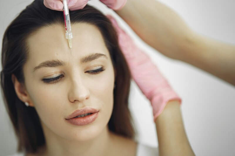 A person receiving Sculptra for a gradual, natural-looking lift—boosting collagen for smoother, more youthful skin with minimal downtime.