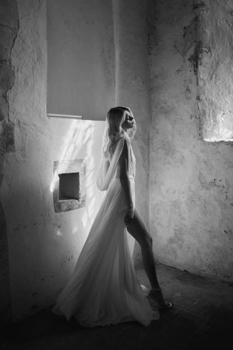 Handmade silk wedding dress with low back, bride photographed in black and white by Benjamin Wheeler