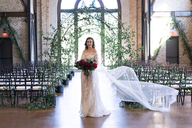 bride smiles at the camera during her bridal portraits at Iron Manor in Houston Texas by Swish and Click Photography