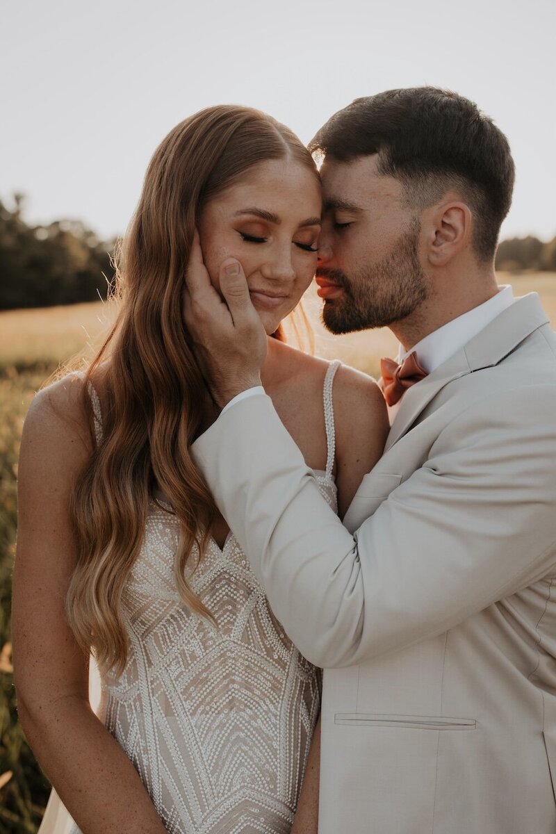 groom embracing bride after their wedding