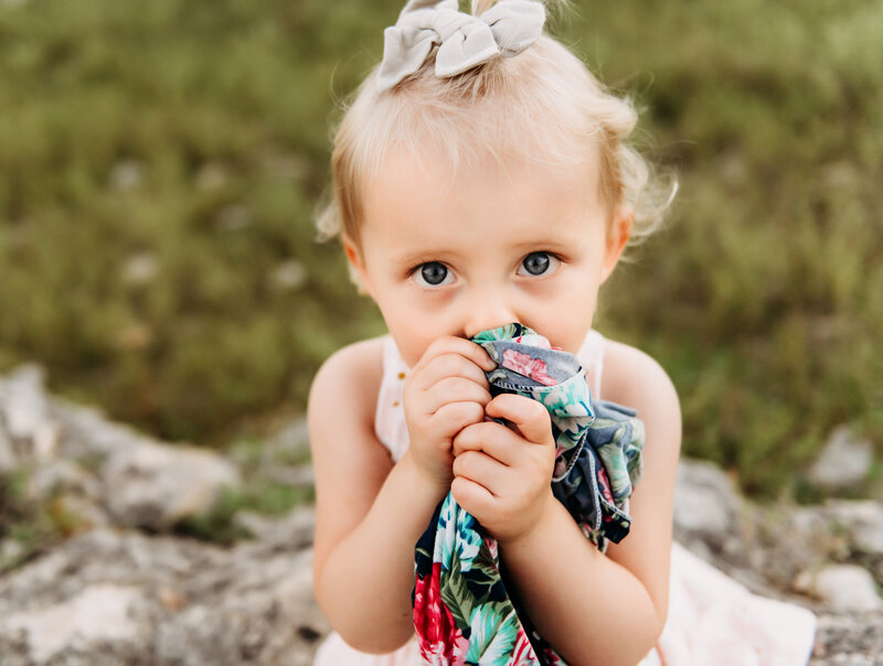 Little girl holding blanket