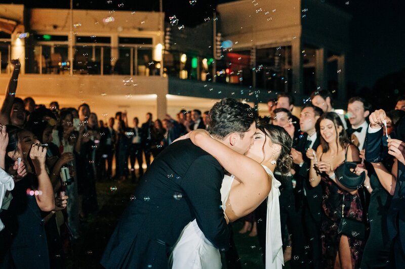 Bride and groom kissing at their wedding