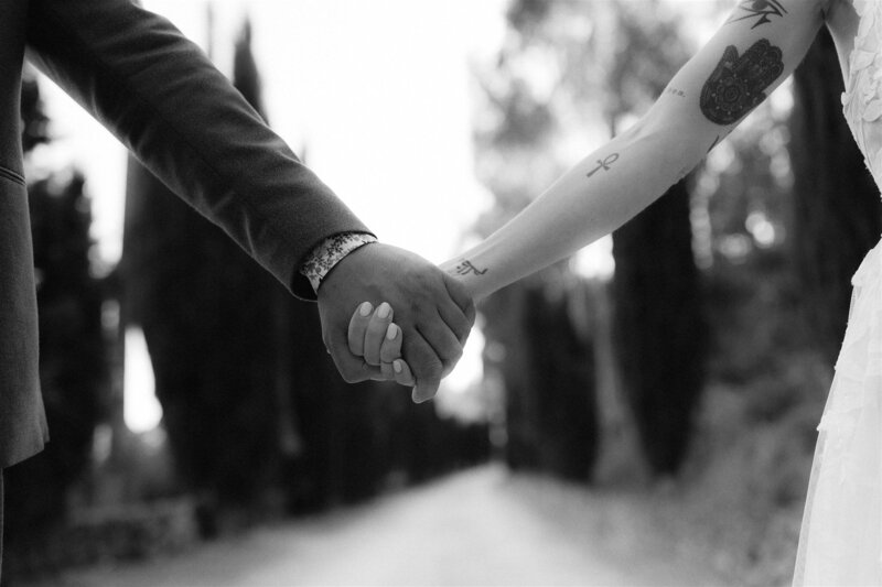 holding hands bride and groom