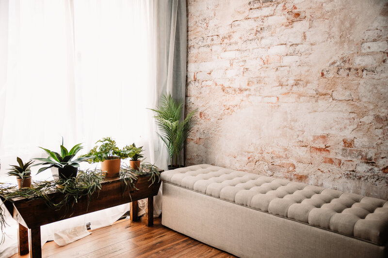 grey bench, wood bench, brick wall and window