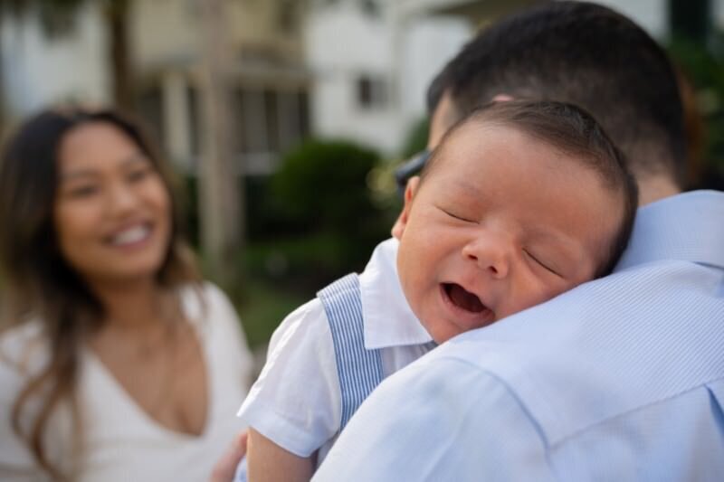 Smiling-baby-in-loving-embrace