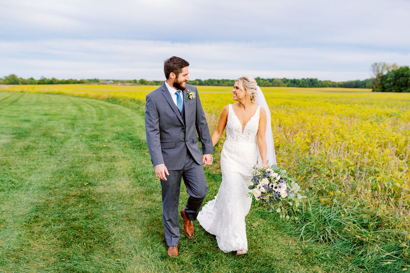 couple just married walking around venue bride and groom portraits