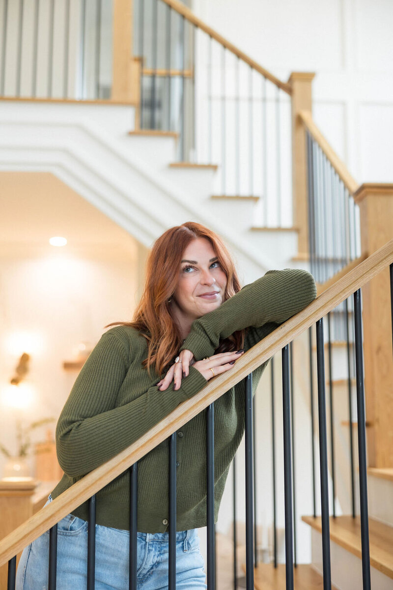 Jacie Dykes on the stairs at a luxury Raleigh home