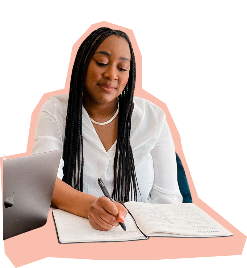 Woman smiling writing in a notebook