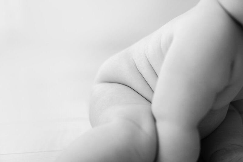 Minimalistic photo of baby rolls
