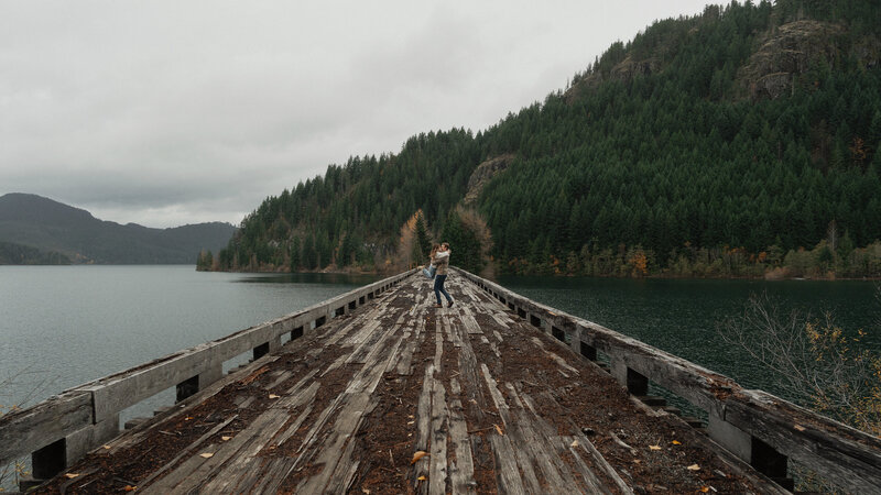 Couple on a trestle bridge in Campbell River during their engagement session by latitude 49 photography