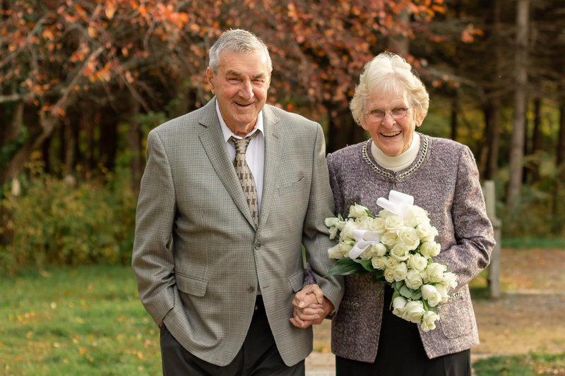 eldery couple anniversary in autumn at park