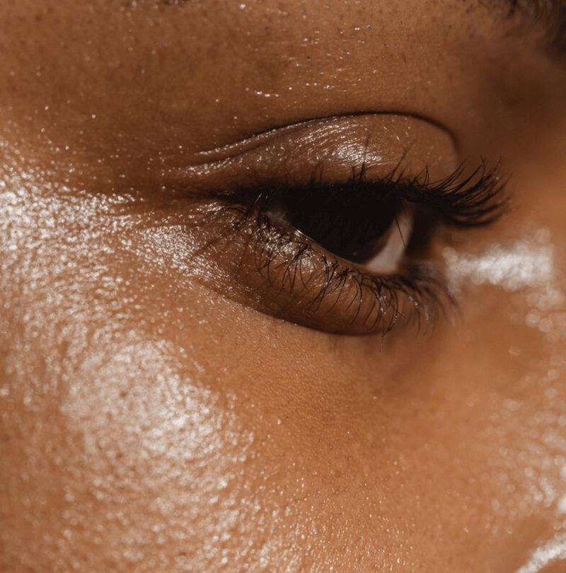 Dark Skin Eye Lash Close up with dewy skin