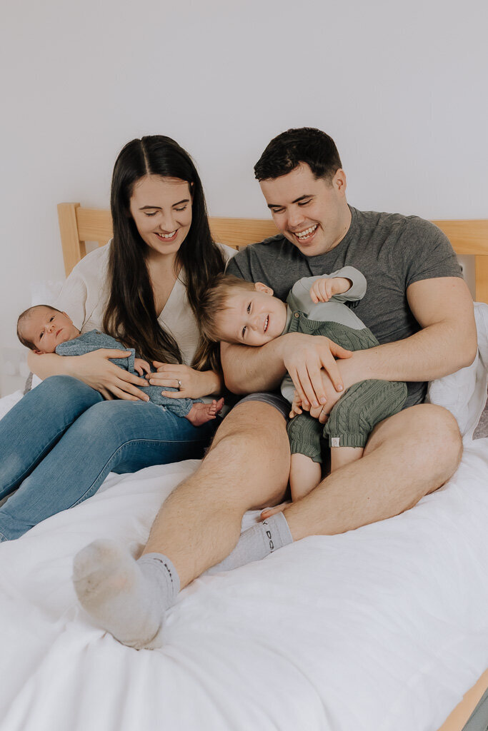 Family laughing together during lifestyle photography session in the High Peak