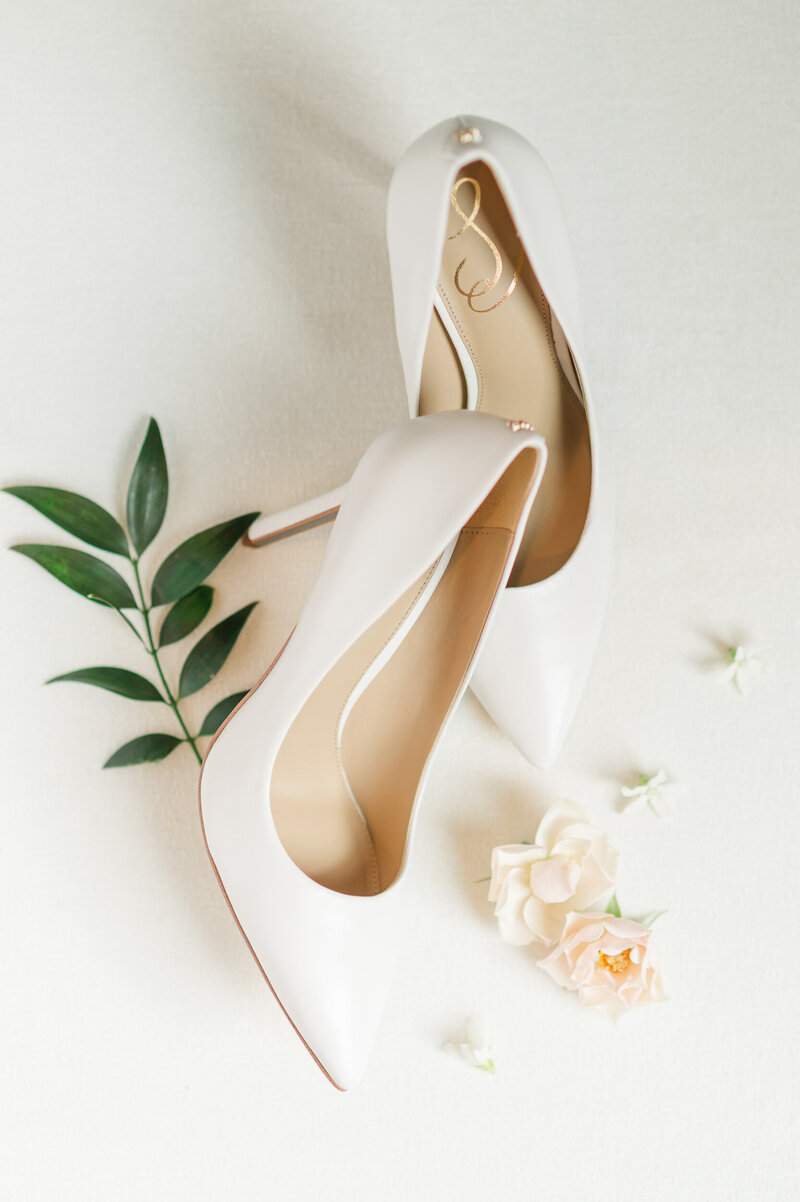 White bridal high heels on a white background.