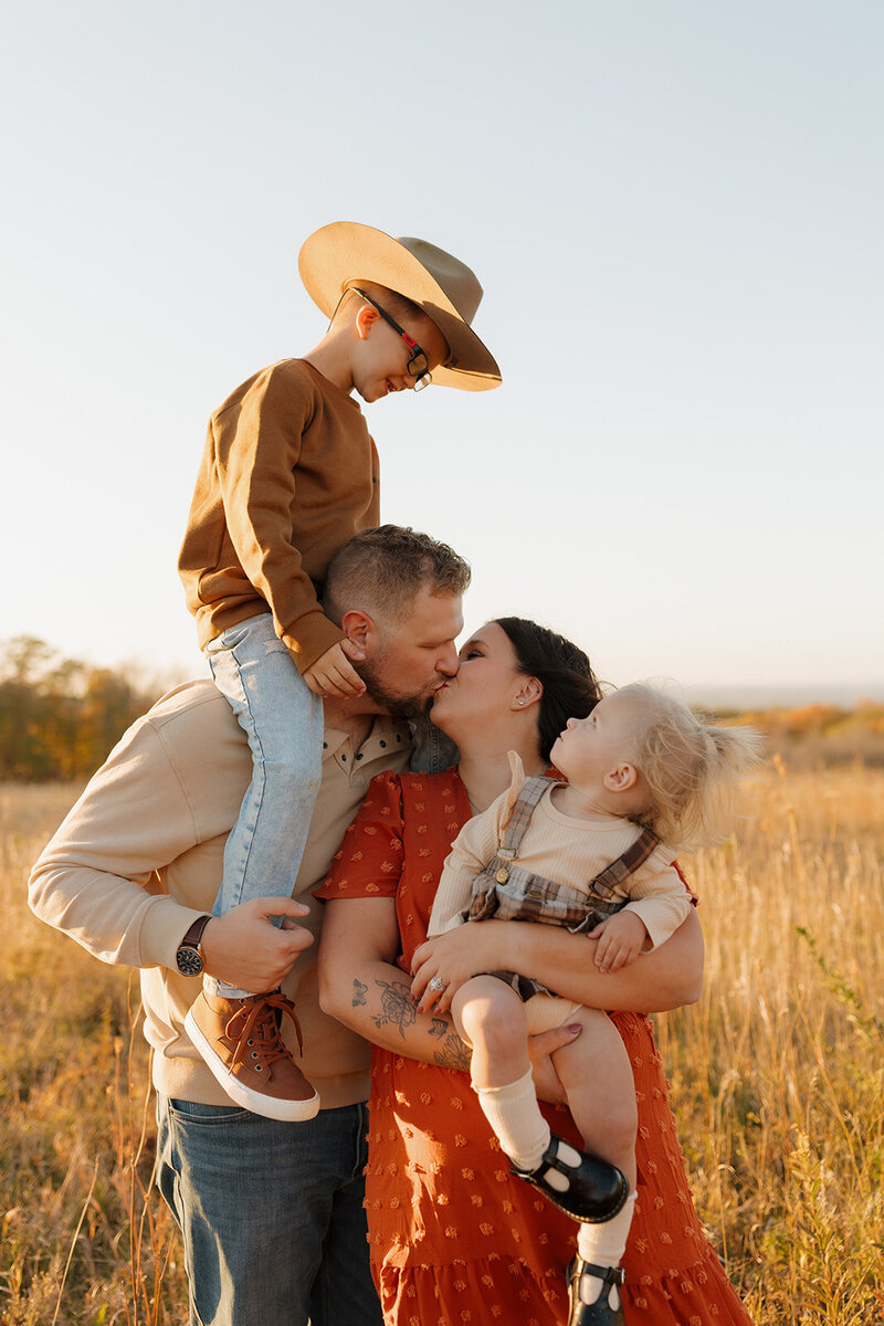 family having fun during their fall family photo shoot in blue mounds wisconsin