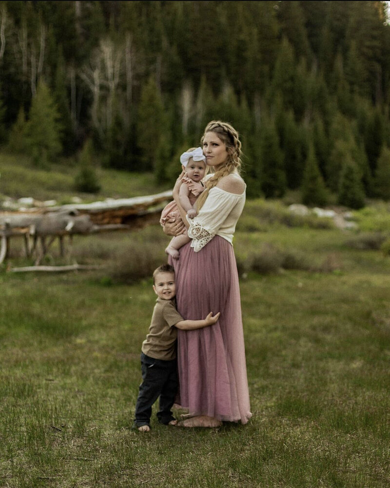 Mom with her two children huffing her in the mountains of Salt Lake City, Utah