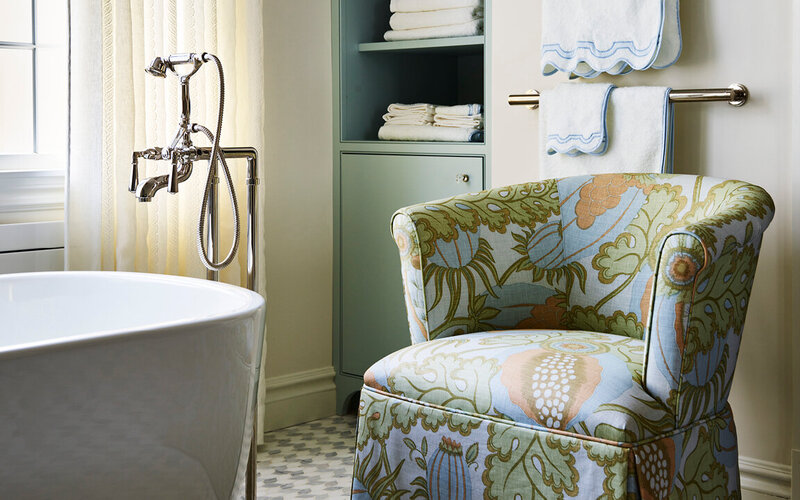 Best interior designers in Boston renovate a Milton bathroom with a Kallista tub and a Christopher Farr Cloth slipper chair for a refined classic look.