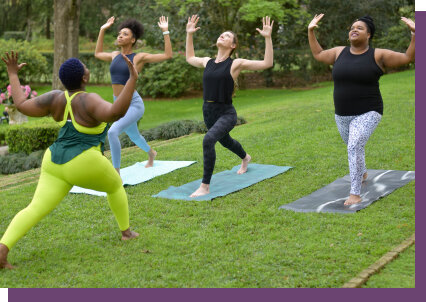 Group of women doing yoga in the park