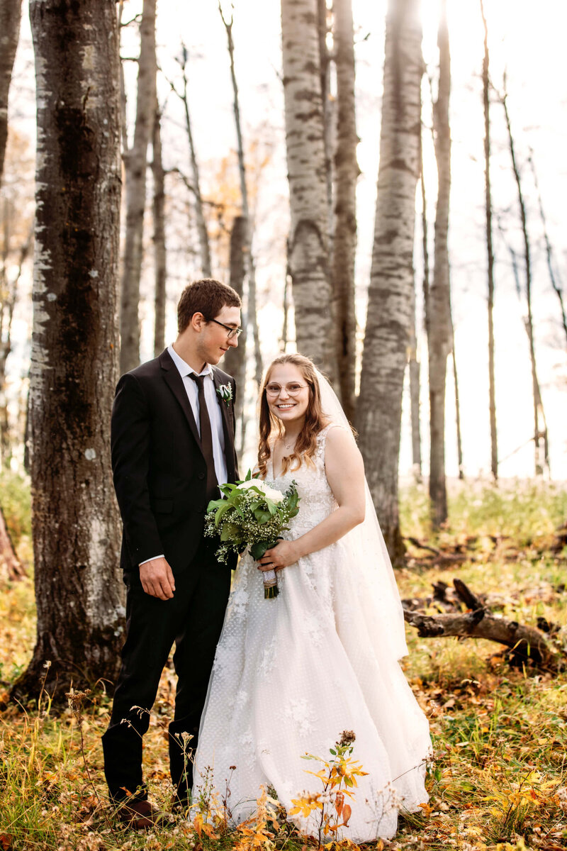 bride and groom amongst trees