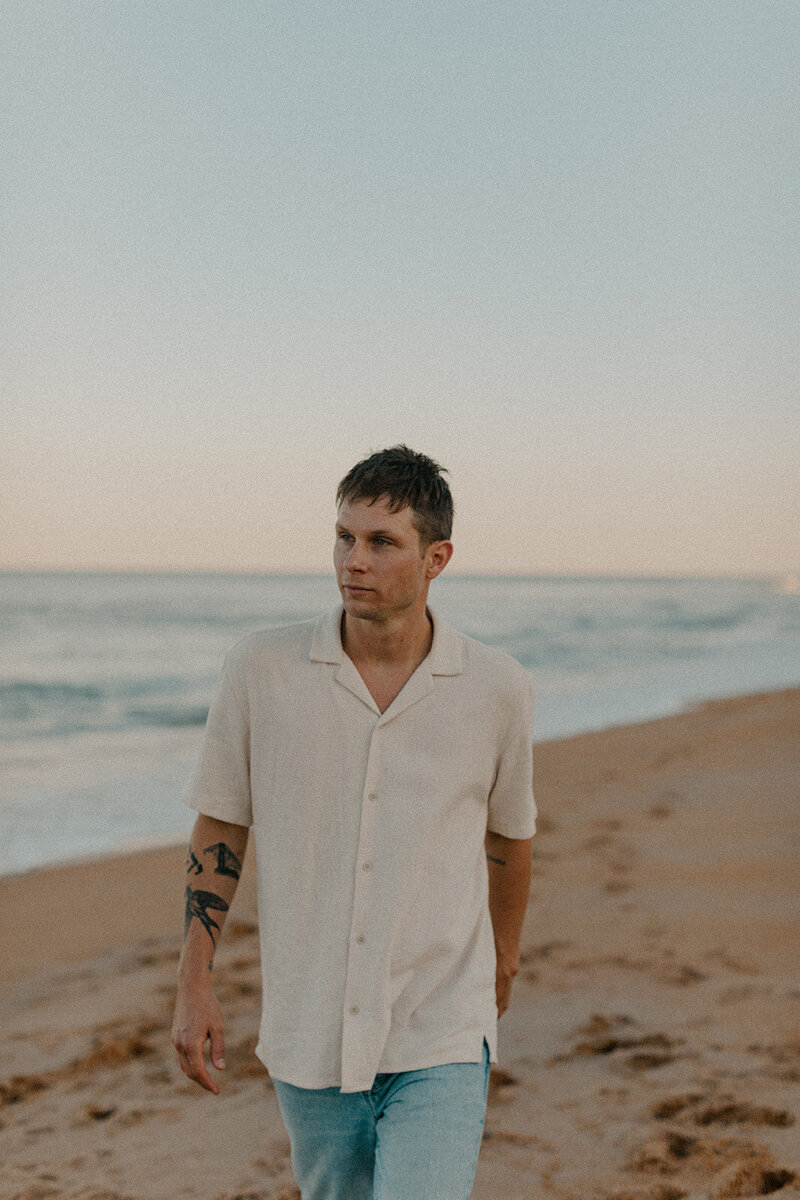 man walking on the beach