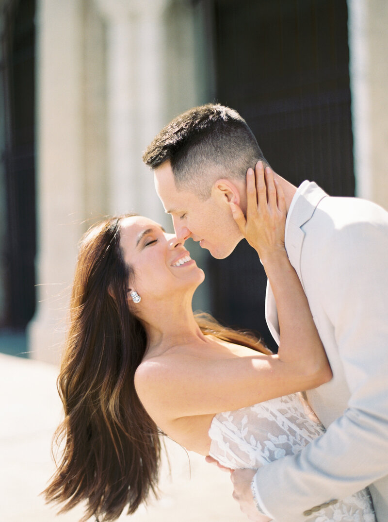 bride and groom toasting champagne on wedding day at hotel zamora in Florida