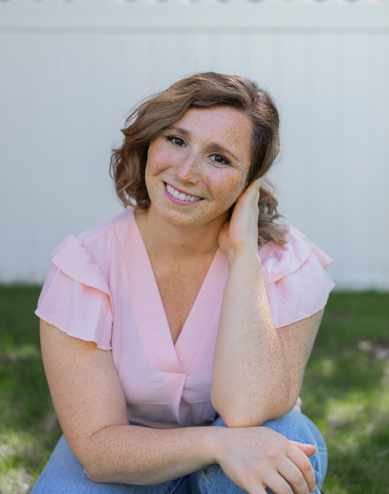 Portrait of Steph Spirou smiling outdoors, professional New Jersey family and newborn photographer