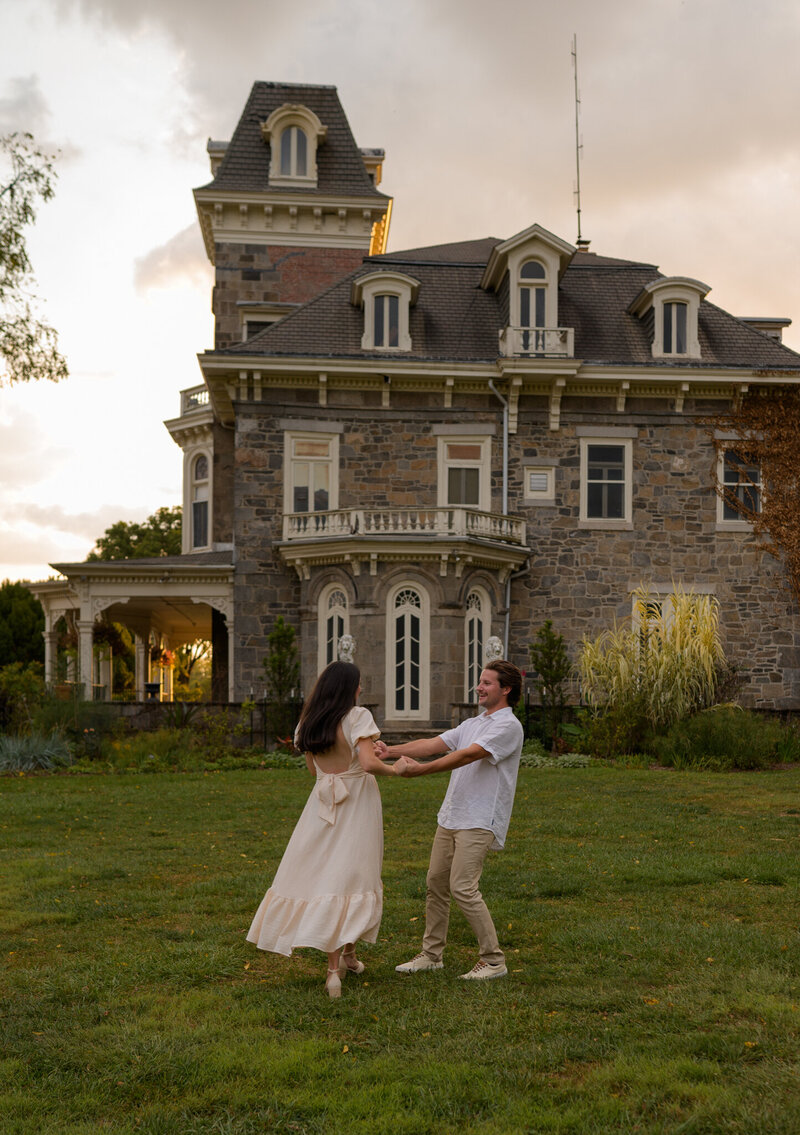 Maryland couple holding hands in field