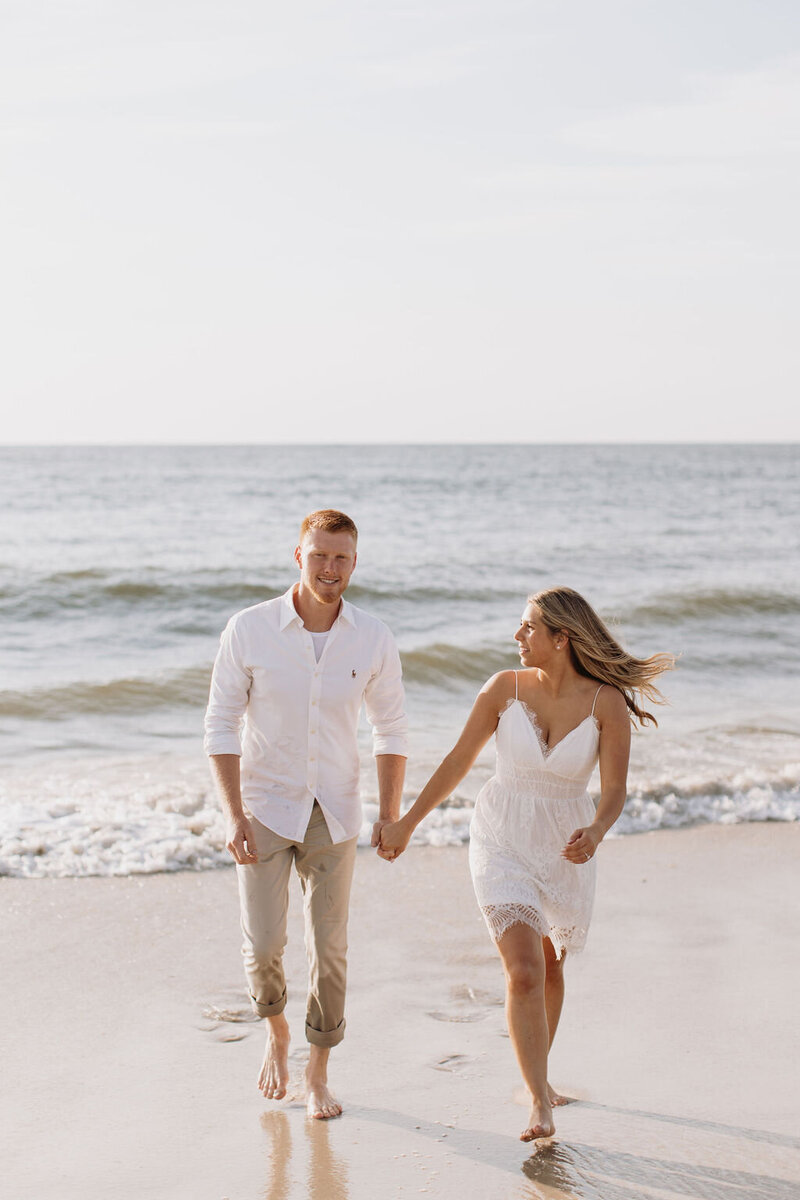 New jersey couple holding hands on the beach for their engagement photos