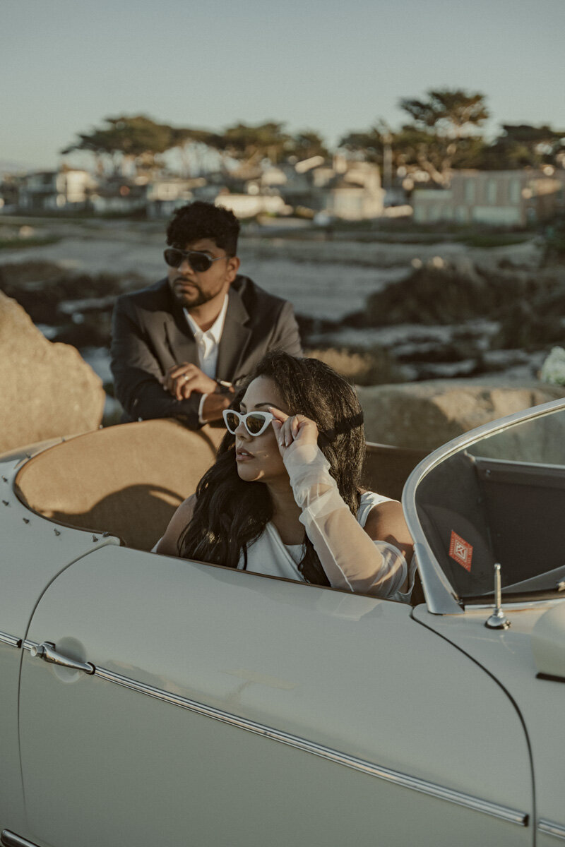 bride and groom in vintage car in Big Sur