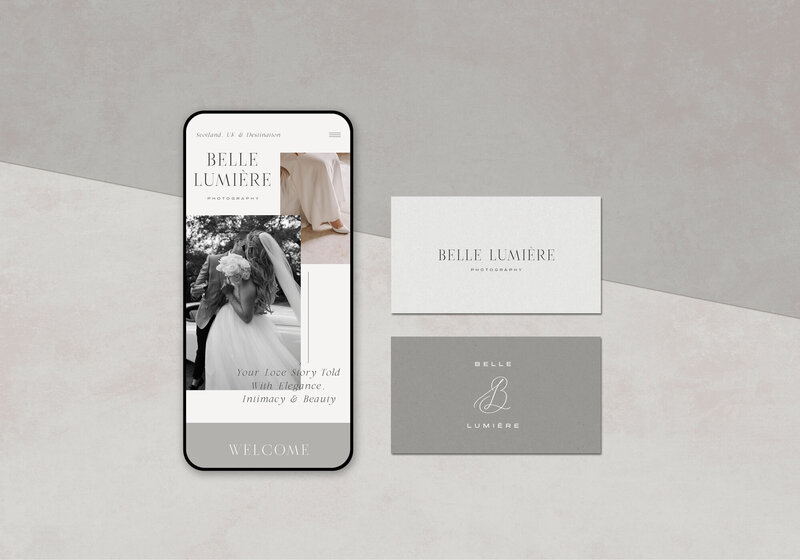 Website and business card mockup for Belle Lumière Photography styled on a warm grey background